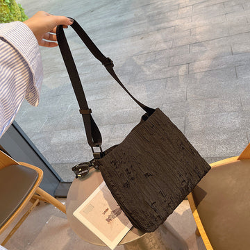 2025 new Korean college style light and simple large-capacity pleated fashion canvas commuter single shoulder oblique span women's bag