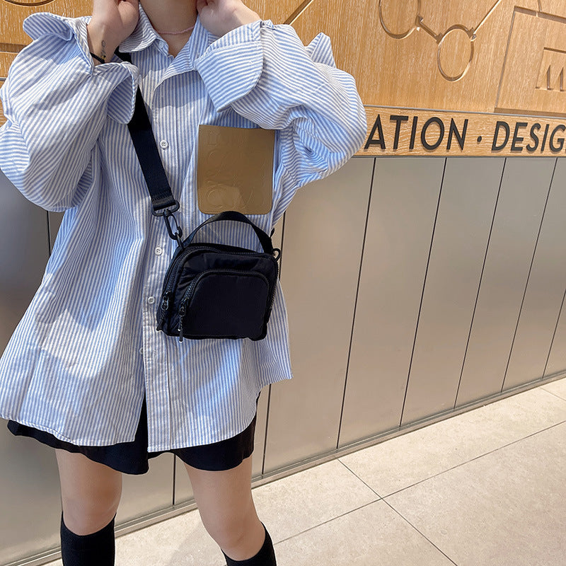 2025 summer and autumn new shoulder messenger bag ins casual hanging bag portable lightweight Oxford cloth mini bag trendy bag