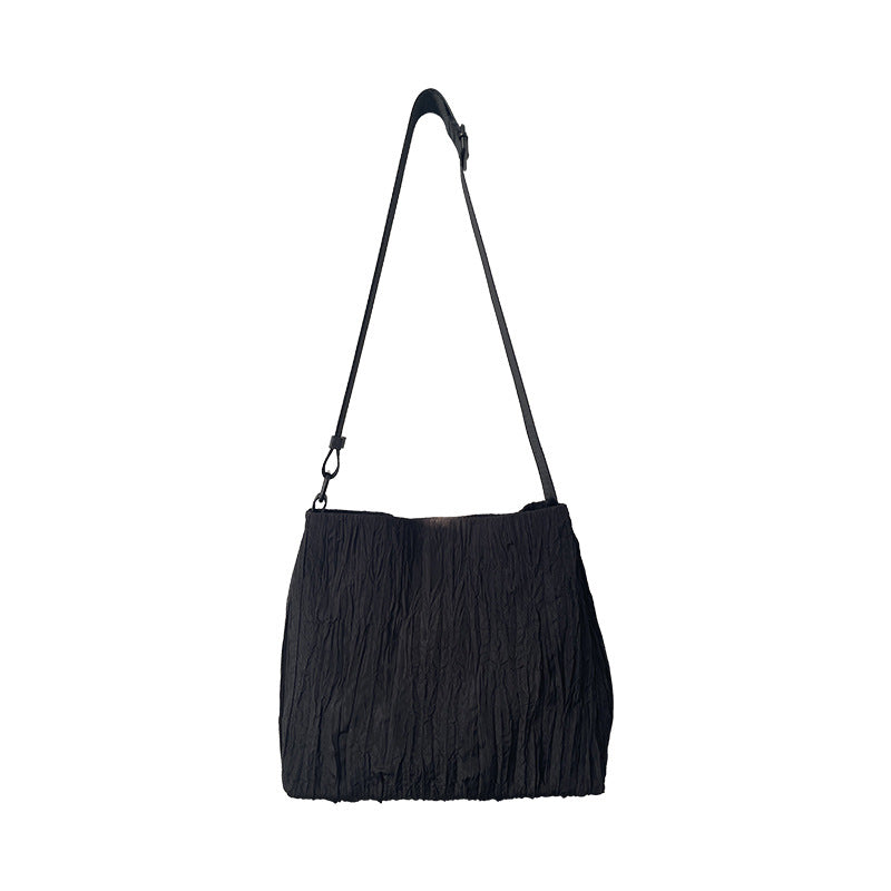 2025 new Korean college style light and simple large-capacity pleated fashion canvas commuter single shoulder oblique span women's bag