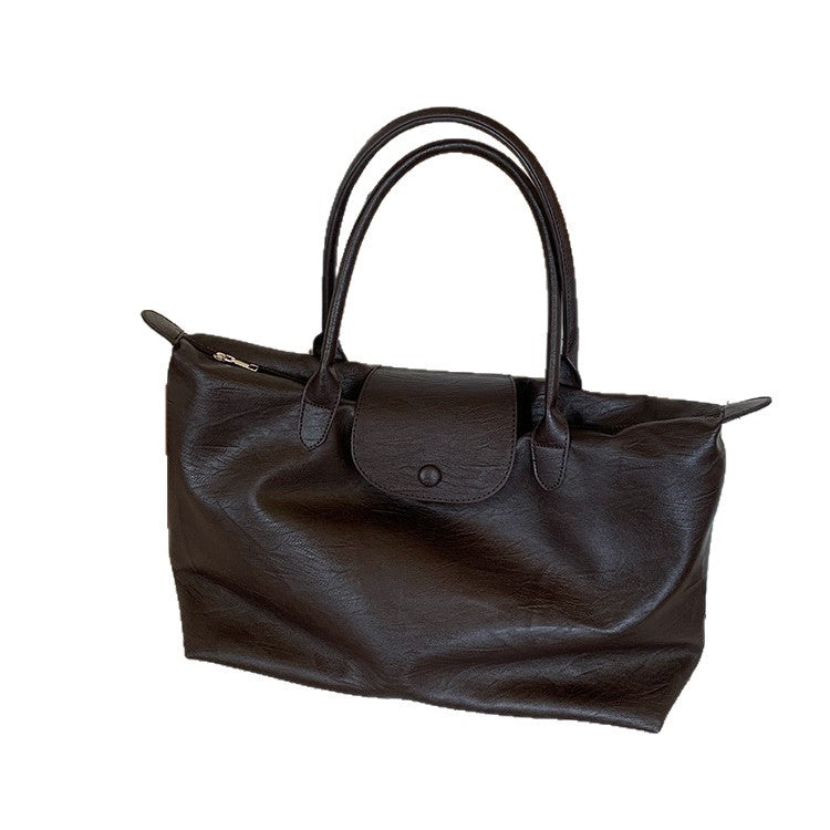 Large-capacity commuter tote bag, black hand-held short-haul travel bag, light business trip, waterproof, portable luggage bag, female.