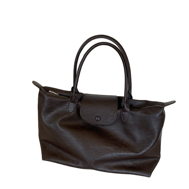 Large-capacity commuter tote bag, black hand-held short-haul travel bag, light business trip, waterproof, portable luggage bag, female.